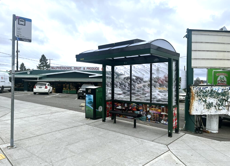 A new bus stop outside of the McPherson's Fruit and Produce stand. 