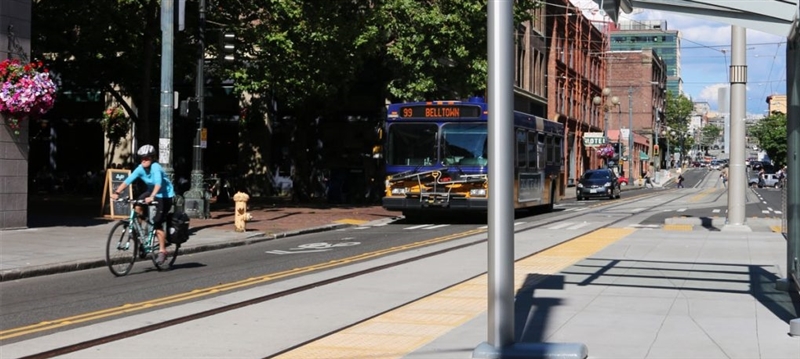 Cyclist riding bike near streetcar tracks