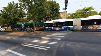 Two buses causing traffic congestion
