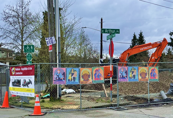 Staging area at E Arthur Pl and Martin Luther King Jr Way E with Still Essential Workers art