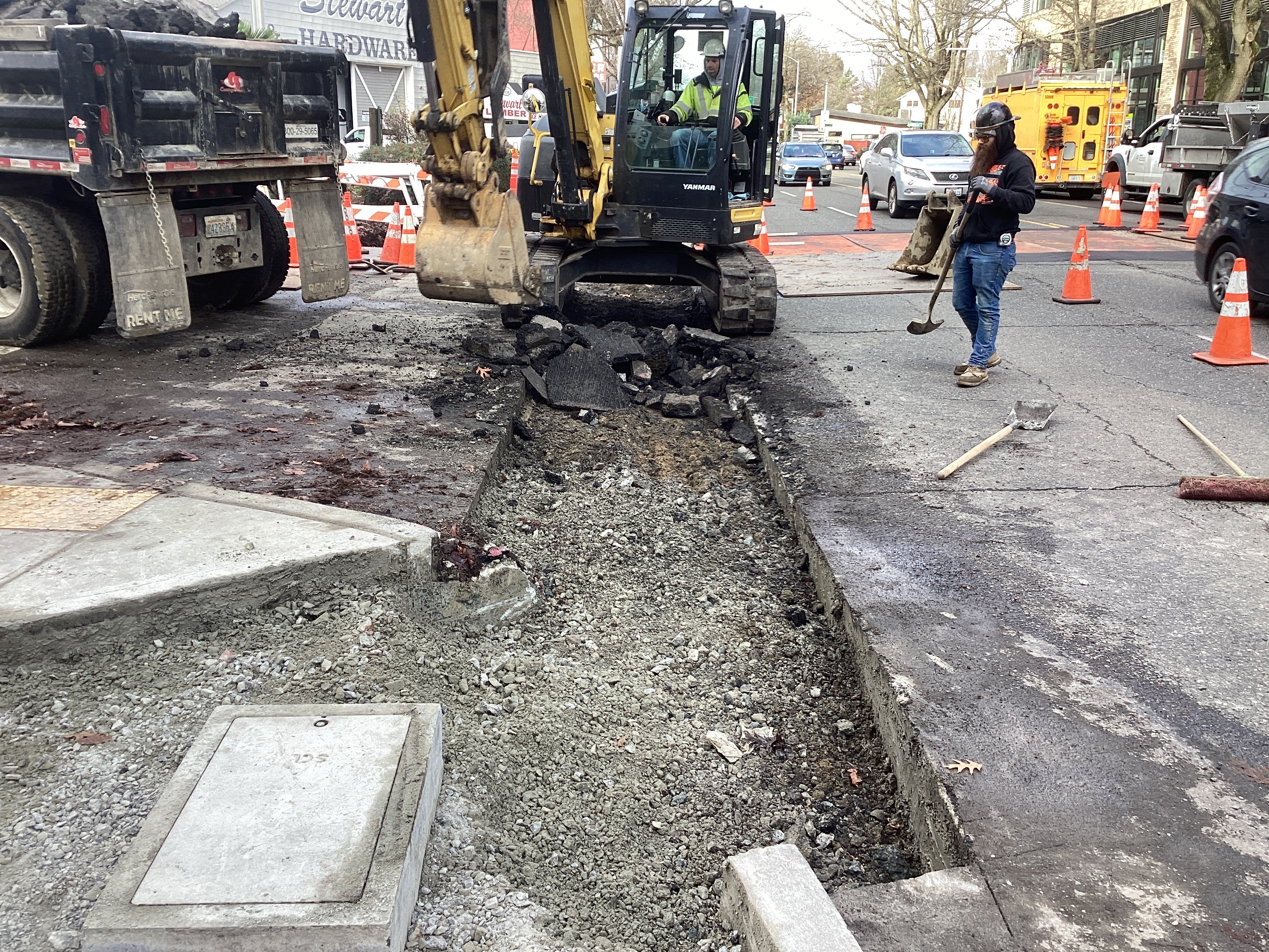 Crews trenching along the west side of Rainier Ave S at S Grand St.