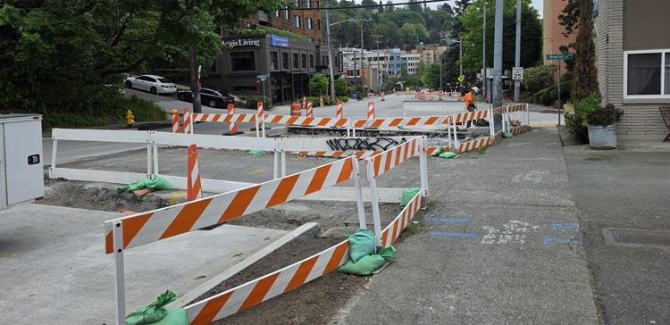 Image shows the street area in front of Cortina Apartments on the west side of Eastlake Ave E. We will be removing the old street and pouring new concrete on the weekend of May 8.