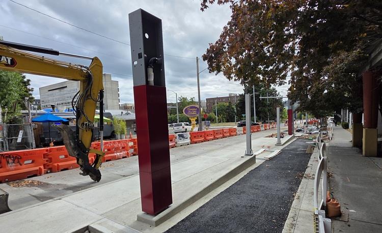 Image shows the first sections of new RapidRide bus shelters being installed in the University District