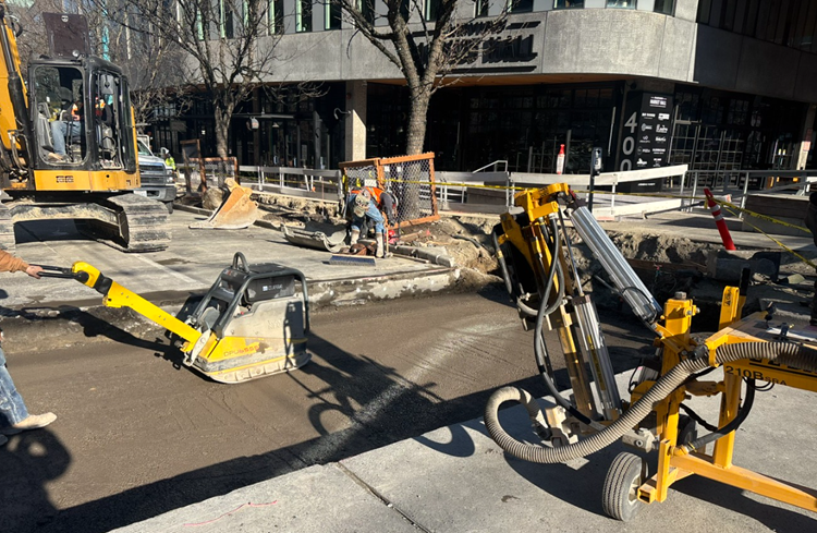 Image shows the construction team preparing to pour concrete to form new road panels