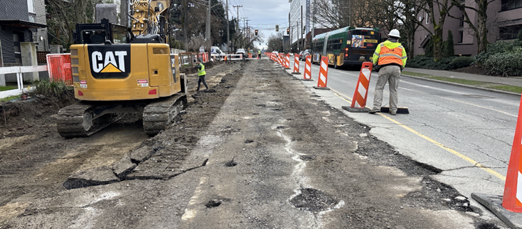 The image shows the team breaking up the existing road surface north of Garfield along Eastlake Ave E
