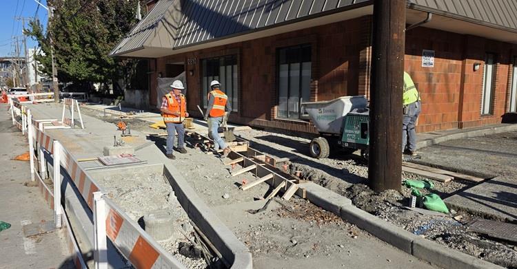 Image shows our inspectors reviewing work happening at E Hamlin St