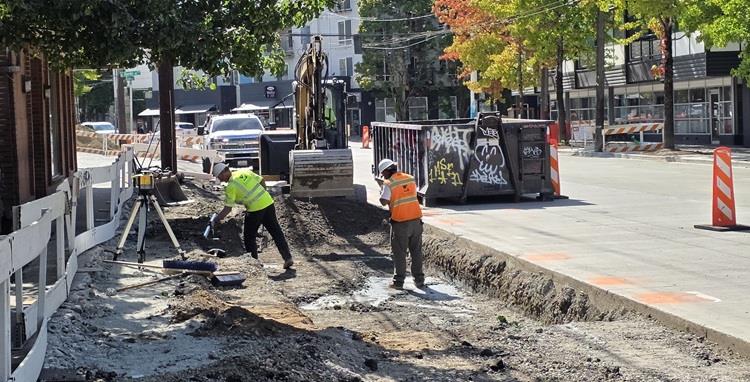 Image shows our team working at the northbound E Hamlin St bus station. 