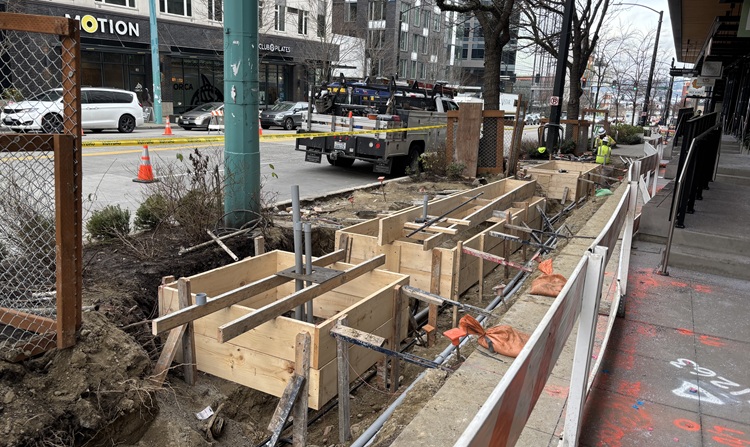Image shows the construction team preparing to pour concrete for new bus stops and sidewalk