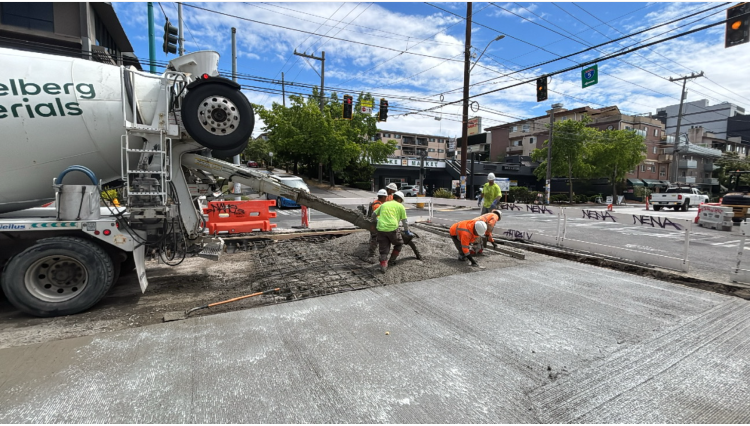 Image shows crews paving the northwest quadrant of Eastlake Ave E and E Lynn St.