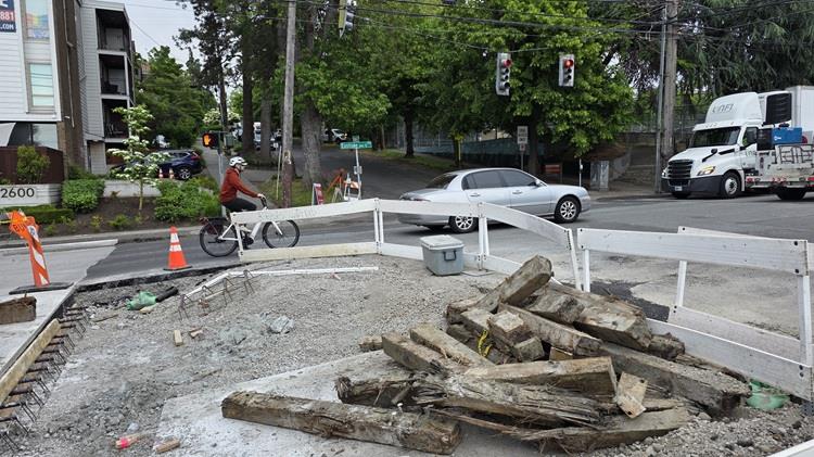 The image shows the team placing new concrete along Eastlake Ave E near E Hamlin St