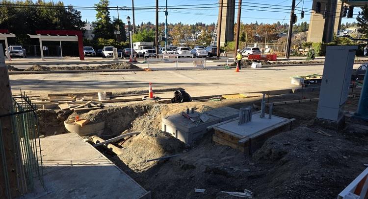 Image shows all the work on Eastlake Ave E near Harvard Ave E. This includes new sidewalks, new bus stops, and a new retaining wall