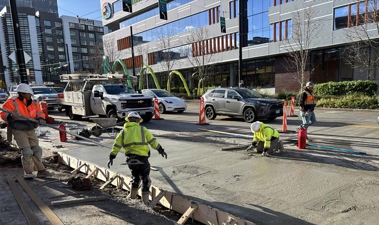 The image shows the completion of new road surface on Valley St