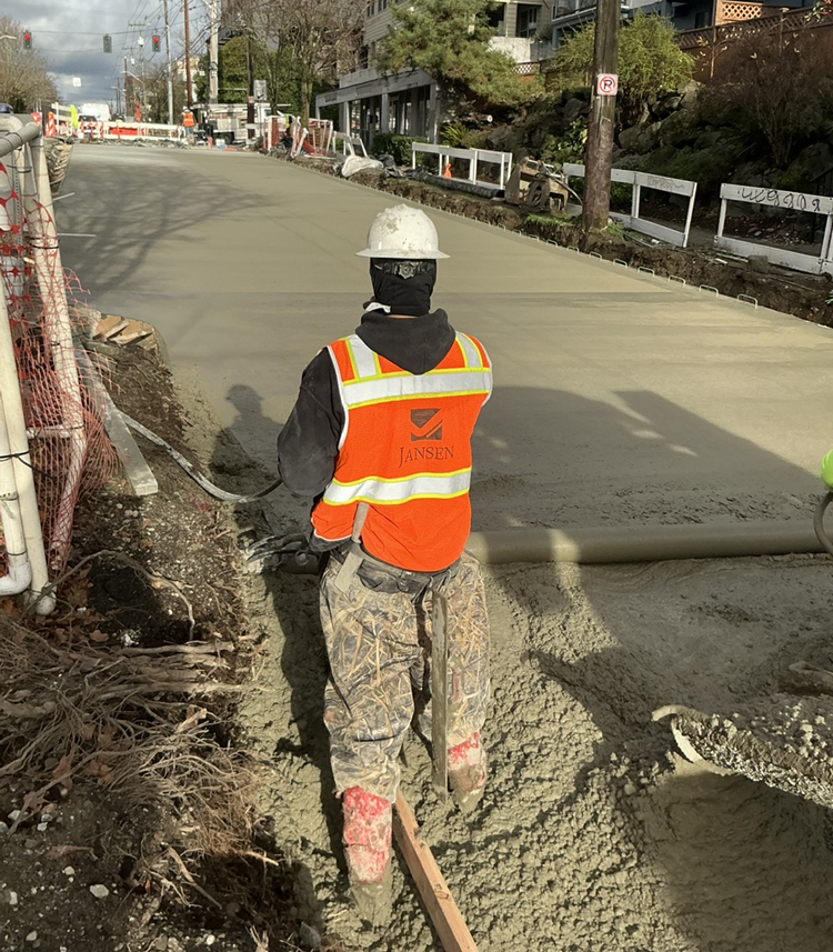 The image shows the team finishing more concrete along Eastlake Ave E