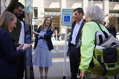 Users studying a prototype wayfinding signage.