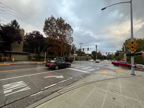 Reconfigured intersection at NE 74th St and Sand Point Way NE with right turn slip lane removal for increased pedestrian safety.