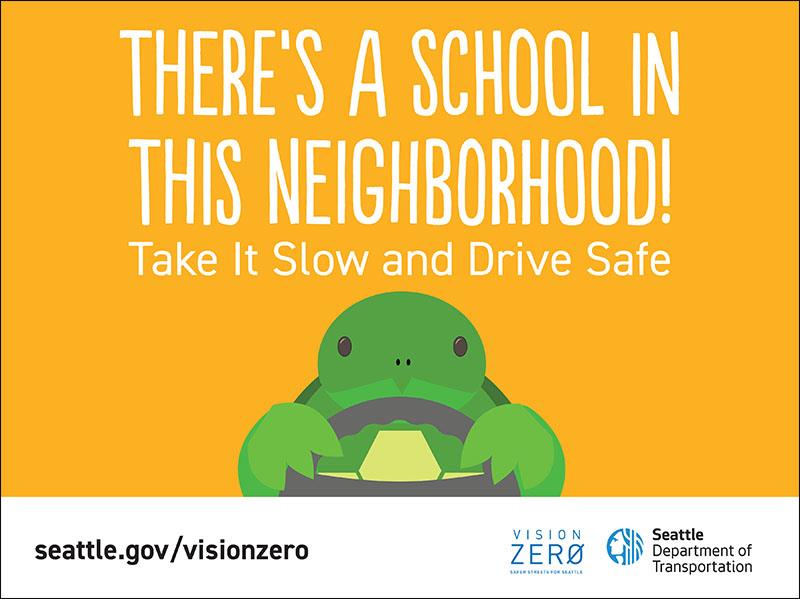 A turtle driving with the words 'There's a school in the neighborhood'