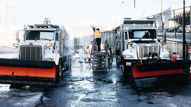 Snow plows next to eachother