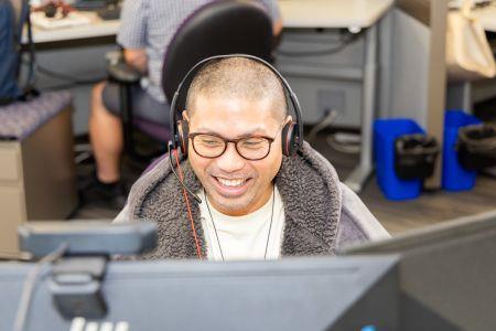 SPU customer service agent speaking on phone.
