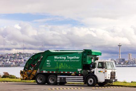 A WM truck with Seattle in background.