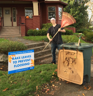 Photo of a man raking leaves