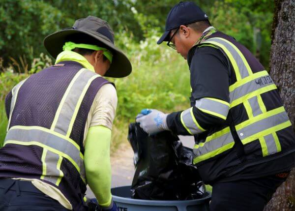 Litter abatement program workers cleaning up litter.