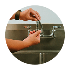 SPU employee fitting aerator on sink faucet.