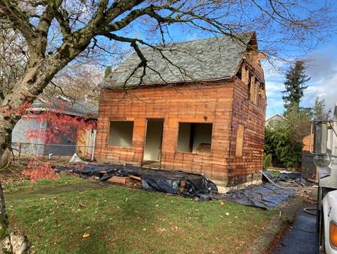 Photo of house after the lead-based painted siding was removed.