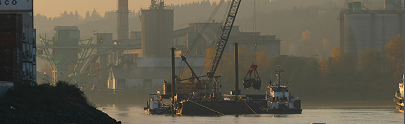 A dredge barge working in the Duwamish on a hazy day.