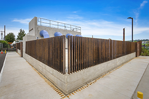 Corner view of station with Corten steel fence.