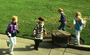 Photo of children playing on grass