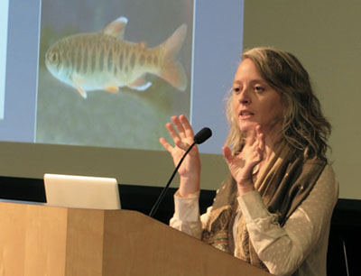 Image of woman presenting class