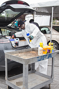 Photo of man disposing of pesticides