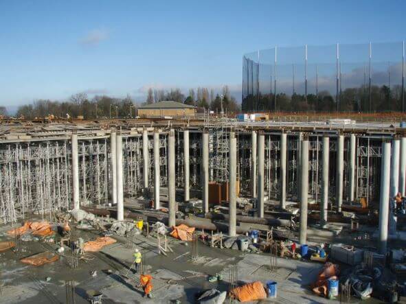 Workers and equipment in the reservoir pit.