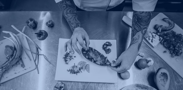 Overhead shot of chef's hands preparing food