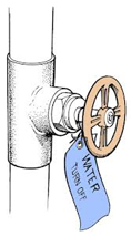 Image of a water shut off valve, a cirle handle on a pipe with a label.