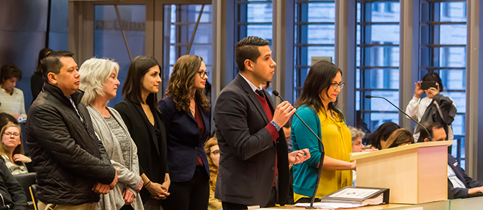 A group of five Immigrant and Refugee Commission members testifying to City Council in Council chambers in support of the City’s proposed 2017 Welcoming Resolution.