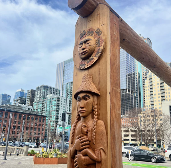 A wood carving of Chief Seattle’s mother Sholeetsa, holding Chief Seattle as an infant