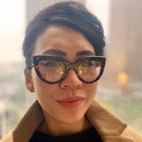 Amy wears thick, catseye glasses.