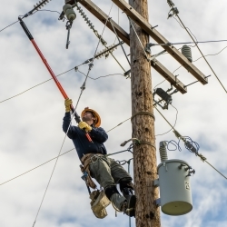 Lineworker on Pole Photo