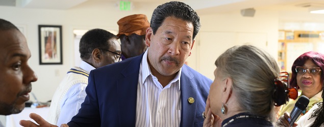 Mayor Bruce Harrell mingles with attendees at a MCAAE gathering at South Seattle Senior Center