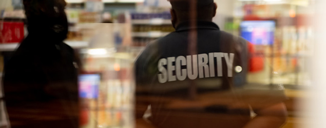 Security guards shown through a window