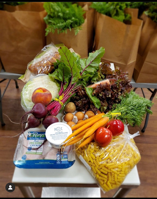 Photo of different types of vegetables sitting on a scale at Byrd Barr Place foodbank