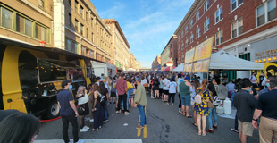 Picture of King Street in Chinatown International District while a street fair is going on.