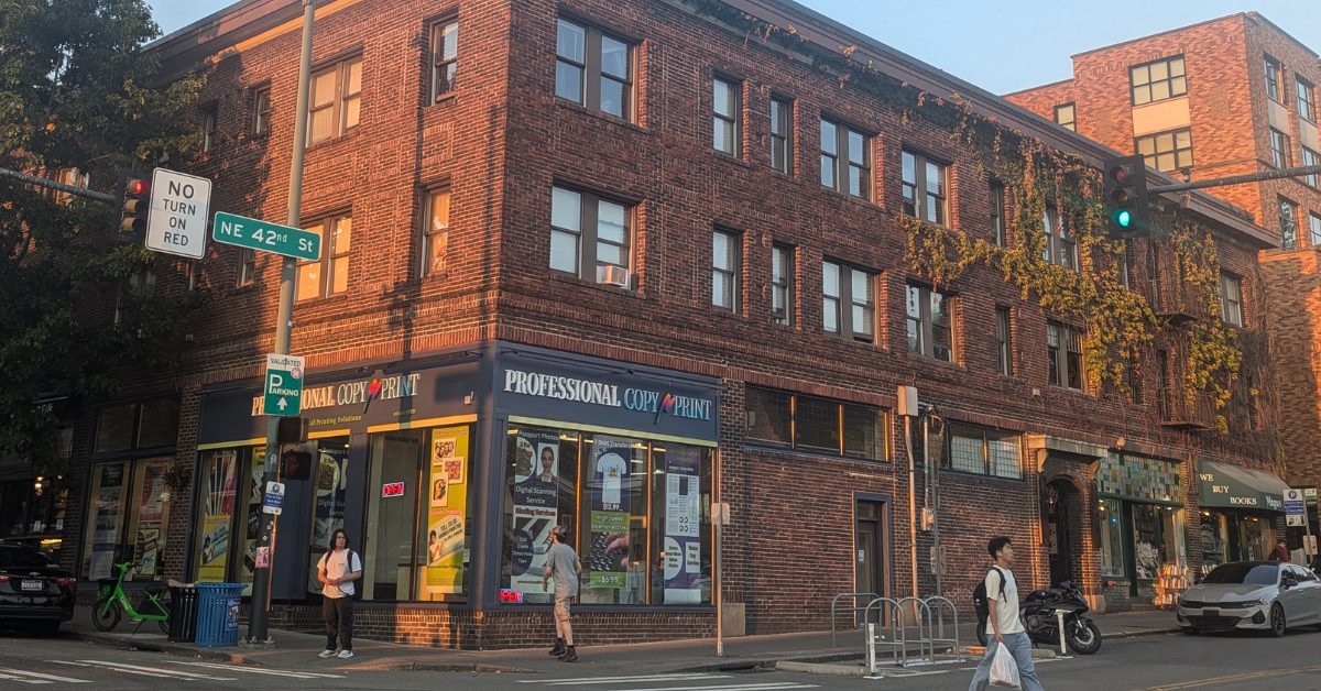 A brick building on a street corner in Seattle
