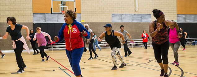 Group of older women at a dance class in a gym