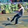 A child practicing soccer 