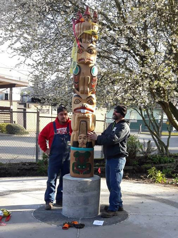 The new totem pole by Haida carver, Fred Lauth, features three “watchmen” at the top, seen as symbolic eyes on Baker Park, playing a role similar to that of watchmen on other Haida poles. 