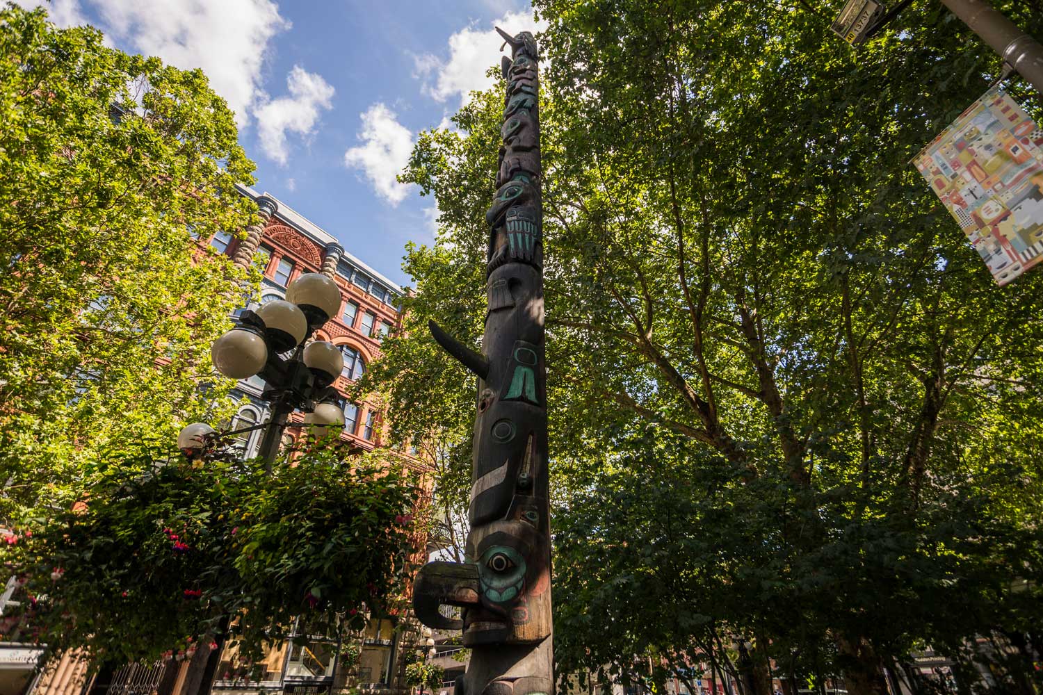 Pioneer Square totem pole and trees - photo by TIA International Photography