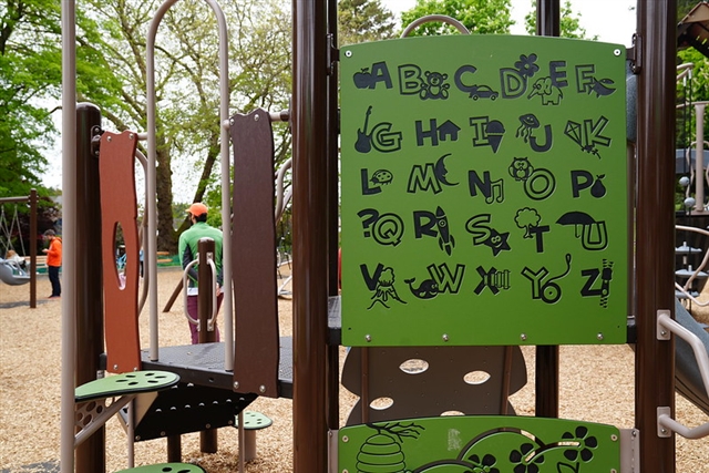 A green alphabet activity panel with letters illustrated by fun, nature-themed images