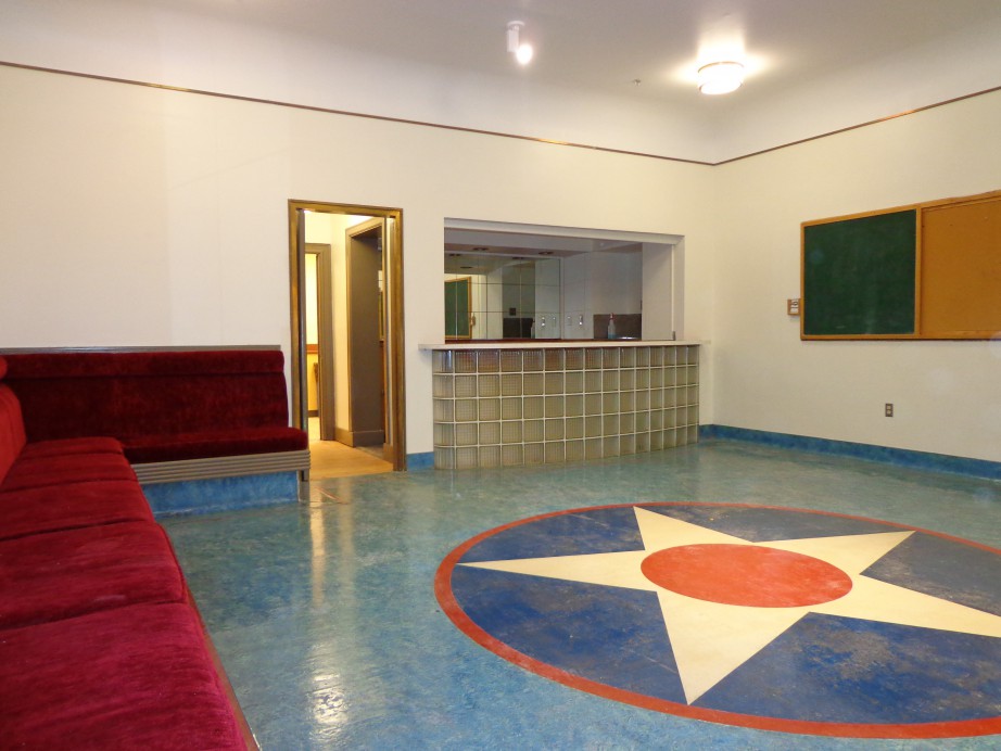 Picture of Magnuson Officers Club rental space. Blue tiled floor with star design. 
